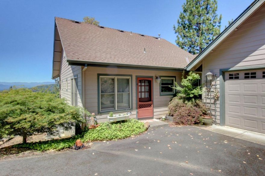 Adorable custom home designed and built by Architect and Contractor Dave Adams! Enjoy your covered deck with sweeping views overlooking the valley and mountains from this peaceful 1/2 acre located close to downtown. You will immediately feel at home when you enter the well-laid out main floor with its open concept and rustic country accents. You'll feel like just stepped into the pages of Country Home magazine. The fireplace provides ambiance in winters; in summer open the front and back Dutch doors and a lovely breeze blows through. The daylight basement is framed, plumbed and wired for the addition of a bedroom or even a workshop. The upstairs bathroom is plumbed and ready for a shower. You don't often find a house like this-smaller square footage but custom design and build. This super cute cottage will capture your heart, call for an appointment today. Seller is a licensed realtor in the state of Oregon.