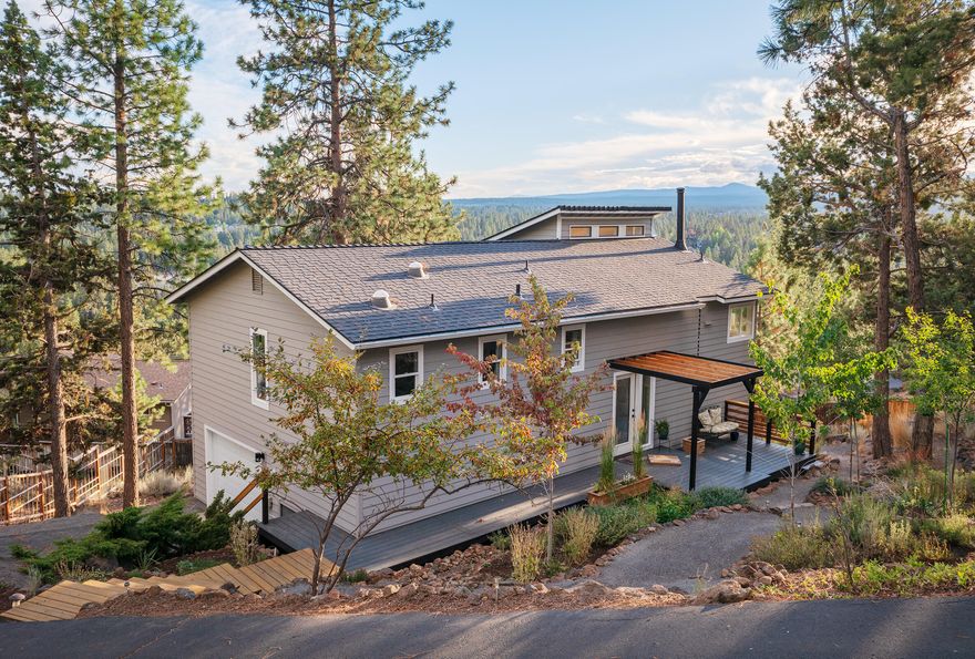 Looking for fantastic light, expansive views, space between neighbors, quiet street and nature? This 4 bed, 3 bath home is beautiful inside and out with updated timeless details. Almost everything is new! cabinets, flooring, windows, decks and more! Enjoy the sunset over Mt. Bachelor from the heated, built-in dining bench seat! Incredible views abound in almost every room with views of Mt. Bachelor, Tumalo Creek Canyon and mountain ranges. Looking to build an ADU? There is room on the nearly 1/3 acre lot! You will love the close proximity to Newport Market, coffee shops and restaurants that are all just a quick stroll or bike ride away! Additional features include heat pump with ac, woodstove, solar tube lighting, multiple decks, natural landscaping and a pollinator garden. The views, light, natural setting, privacy and space are unparalleled and very rare for Bend. Come live the Bend lifestyle!