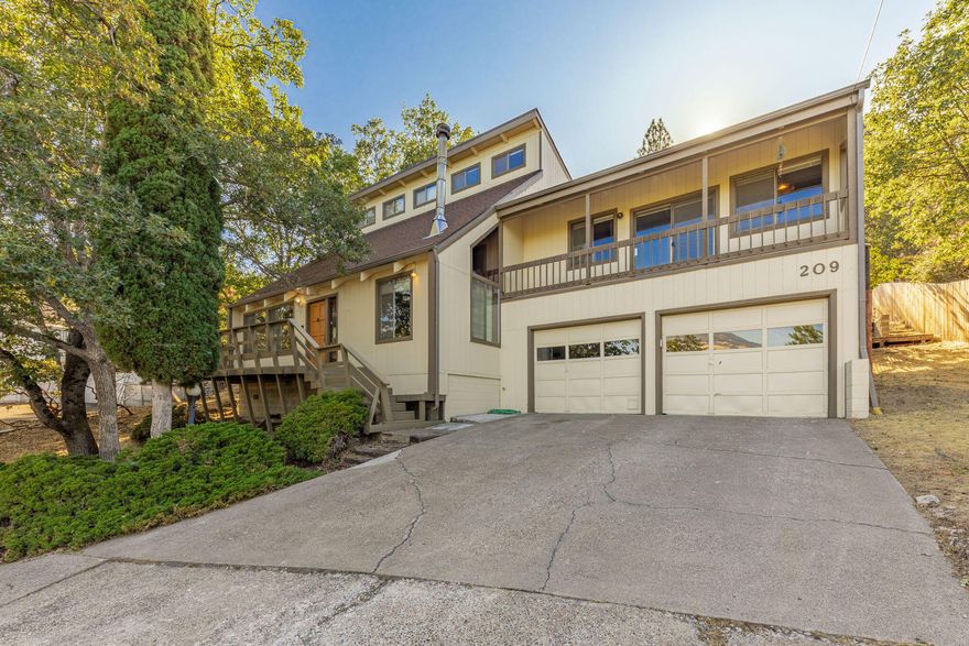 Perched above downtown Ashland, this captivating postmodernist designed home boasts strong structural integrity and a unique clerestory roof design. Unleash your creativity to elevate this treasure back to its former glory. With a loft and a cozy library nook, your artistic expression finds its place. The home's various spaces and levels, including the family room's wet bar, add to its charm. Revel in eastern views and sunrise coffee. Embraced by the hillside, it offers a tranquil haven full of promise. Start planning your improvements and begin building your equity today!