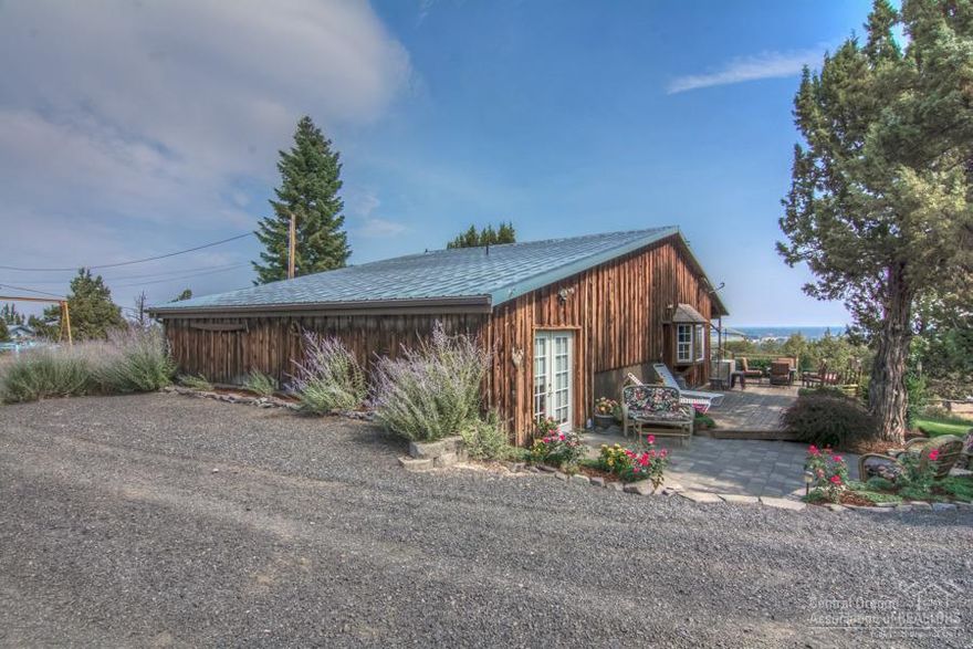 What a home! Located just past Eagle Crest in Redmond. Incredible views, fenced & cross fenced. Two shops, one 40x40 and other is 44x32, extra garden shed 16x20. Two gated entries w/ full circle driveway. Very rustic wood beam ceilings, tall cabinets & many upgrades. 5 individual areas w/ water. 4 shelters for your animals. Two propane fireplaces, just so much to see. There is an office that could be converted to a 3rd Bedroom. Bring your toys & your animals, you will not want to miss this one.