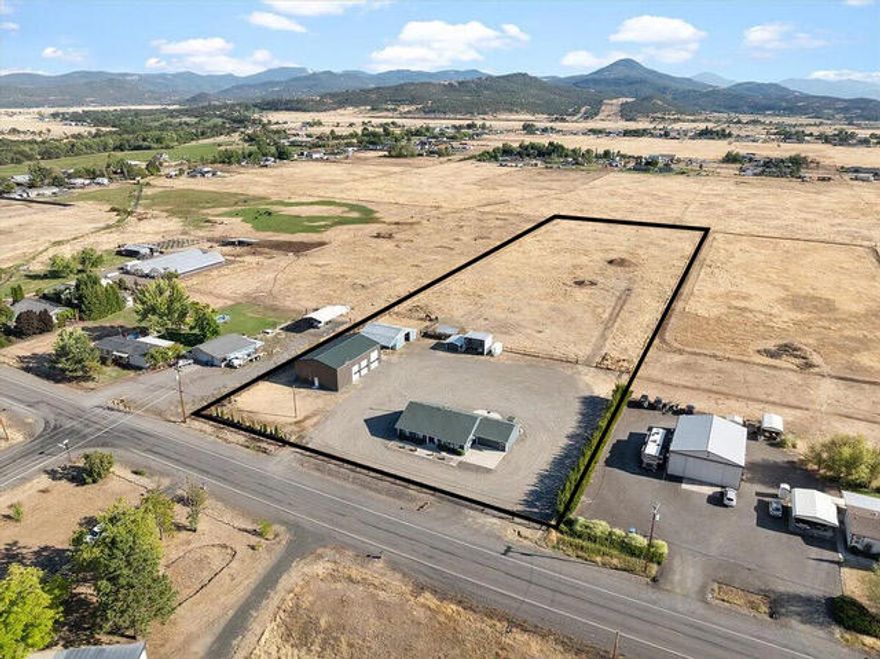 Discover the perfect blend of comfort and rural tranquility on this 5-acre flat usable Horse property, complete with a fully insulated 40x60 shop with heating and air, 3 stall barn with finished tack room, livestock paddocks, RV hookups, and fenced pasture that offers panoramic views. The gated property and home have been extensively renovated with premium features, including custom cabinetry, granite and marble countertops, LED lighting, a newer roof, flooring, an on-demand hot water heater, and water filtration system. The grounds are designed for low-maintenance, with fire-resistant landscaping, electric gates with keypad access. The versatile shop boasts an array of upgrades, such as a full bathroom, heating & cooling, washer & dryer and is perfect for a home business. Whether you're looking for a horse property, mini farm or space to live, work, and play, this pristine property offers the best of both worlds.