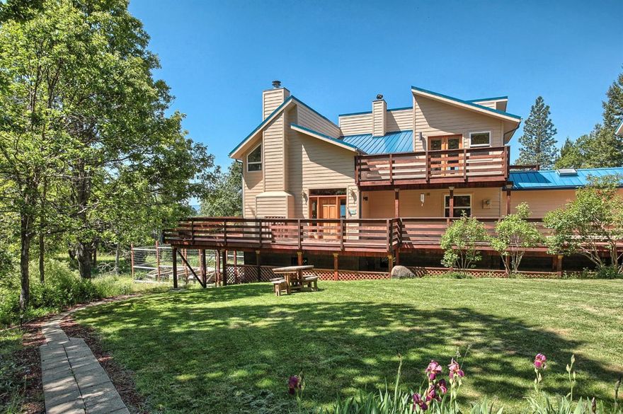 Amazing 80 acre mountain retreat with incredible views of the Rogue Valley and Mt. Ashland. This secluded and private custom home has over 5,000 sq ft of living space, 4 bedrooms and 5 bathrooms and is located less than ten miles from Ashland. The main house has two stories plus finished daylight basement. A separate guest quarters are a part of the main house and discretely located for privacy. In addition, there is a large drive-through shop. It is a two story separate building (30' x 60') with 12 foot overhead doors at either end, two drive through carports on each side and an additional guest quarters above the shop. This property could be perfect for an extended family or small group of friends.