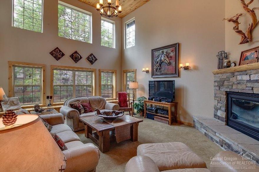 This custom one owner home depicts the lodge atmosphere desired in Sunriver. With its magnificent log staircase overlooking the handsome great room, rock fireplace, soaring vaulted ceilings, remodeled kitchen. The lodge style furniture package & Sunriver decor compliments the 4 bedrooms, 3 are suites, each with its own private deck, 4.5 bath home. There is a full office overlooking the great room and a triple car garage for the toys. This home reflects Sunriver with room and privacy for each family member.