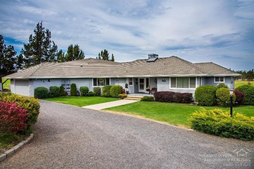 The best of Country Living close to town with Cascade Mountain views. Beautifully maintained single level home on 19.5 acres, including 13.8 acres COI irrigation & pond. Comfy master suite, 2 guest bdr +den. Spacious kitchen w/large center island & slab granite counters. Vaulted ceilings, exposed beams, fireplace & tons of natural light. The perfect equestrian property: 4 stall barn w/attached tack room, shop, & hay loft. Official sized outdoor arena, 3 pens & 3 loafing sheds