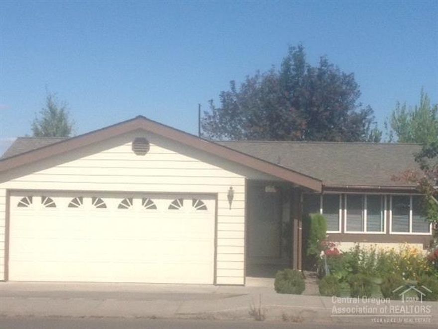 Exceptionally kept, move in ready home with a park like back yard with concrete and paver patio and walk ways. One level home with many upgrades such as tile bathrooms with granite and tile counters, solatube, new carpet in bedrooms, hard wood flooring, utility room with cabinetry, brand new energy efficient refrigerator, forced air, sprinkler system in front and back, double car attached garage. A must see home!