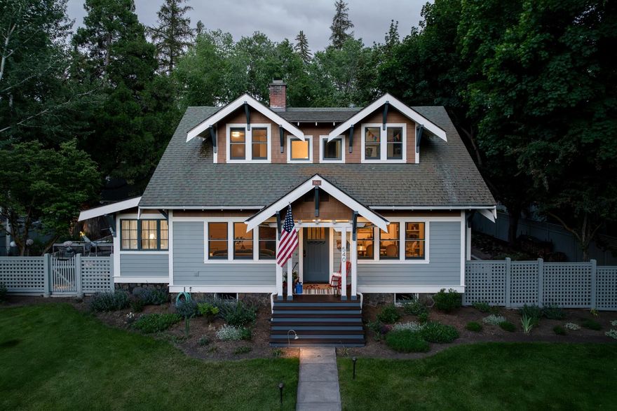 Nestled in the heart of Bend (just 3 blocks to town and 2 blocks from the river) and situated on a stunning and meticulously kept double lot (.32 acres), the Overturf House offers 4251 sf of timeless living space in the historic Drake Park District. This unique 3-level, 4-bedroom (plus bonus room) home seamlessly blends traditional Craftsman touches with modern convenience and timeless finishes. The kitchen has been recently remodeled with beautiful new tile backsplash and Caesarstone counters. New modern lighting has been installed throughout the home. The double lot has sprawling perennial gardens, grass areas for play, a saltwater hot tub, a new fire table - all creating private gathering spaces under the shade of ancient trees. Impeccably updated and lovingly maintained, this historic house in Bend, Oregon, stands as a testament to architectural heritage and contemporary luxury. Past meets present harmoniously, offering a rare opportunity to live amidst