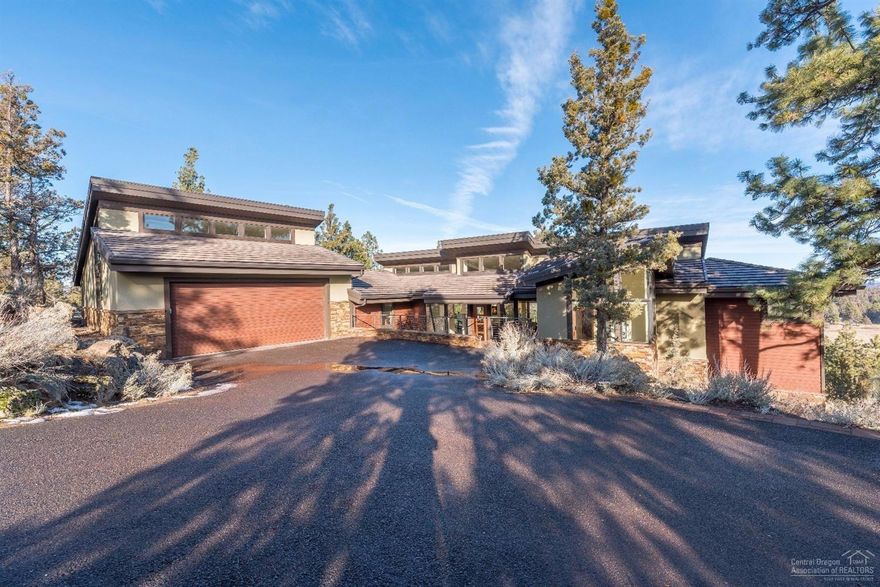 This contemporary home in elite North Rim was just remodeled with a new kitchen island, reconditioned African Mahogany cabinetry, fabulous front door & more. Cascade Mountain and vast views create the backdrop from picture windows throughout. Master, office & addl. bedroom on main; oversized garage is a great bonus. Wired for Cat 5 & sound throughout home, 4+ zones heating/ cooling, radiant heat in 2 baths, motion detectors/ security system. Take advantage of the North Rim clubhouse, tennis court & trails!