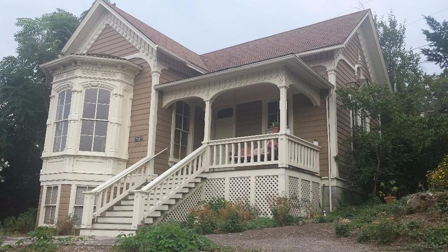The home everyone has always admired in a premier location in downtown Ashland is on the market after many years of love from the current owner. Baldwin Beach Home was built by Baldwin Beach in 1884, a Civil Veteran who moved to Ashland in 1878 with his wife. The home features 11 foot ceilings, covered front porch, parlor, large eat in kitchen, two large bedrooms and two full baths on the main floor with a studio living space with private entrance in daylight basement (no interior stairs from main home). Wonderful large windows with mountain views and original wood floors. One block to downtown Ashland and private parking for three cars and .23 acre triangular lot. A very special home for the buyer looking for charm and historical location, location, location in Ashland. The plumbing, electrical and foundation were redone when current owner bought about 40 years ago. See attached document from City Ashland.
