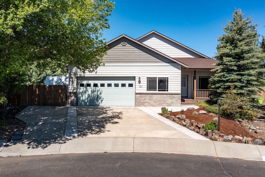 Super well maintained single level home in Hollow Pine Estates! This home is on a quiet cul-de-sac in SE Bend and features new exterior paint, new flooring, open living/dining/kitchen with gas fireplace, plus a separate living room with beautiful built in cabinets and desk! The oversized garage includes a workspace as well as a big storage/mud room. Outside you will find fenced RV Parking, mature landscaping including raised garden beds as well as a dog run, a new shed with deck, gas fire pit and a patio dining area great for entertaining!