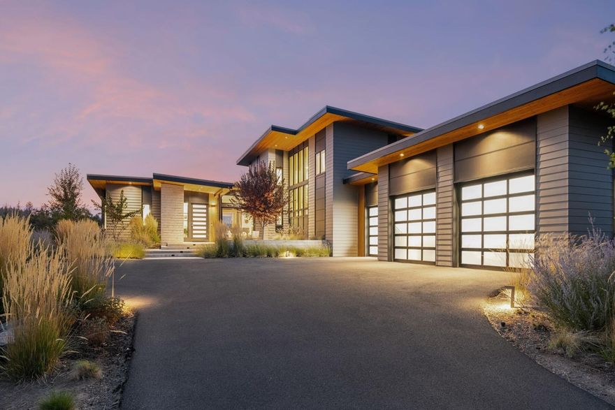 Nestled along the 2nd fairway of Tetherow's award-winning links golf course, this custom Timberline Construction home showcases Cascade Mountain views and seamless indoor-outdoor living. Designed with meticulous attention to detail, it blends clean lines, warm finishes and expansive windows that invite natural light and the outdoors in.
The main level features a serene primary suite, great room, dining room, library space, guest bath, mudroom/laundry room & kitchen designed for culinary enthusiasts w/ a large pantry and wine refrigerator. Upstairs features two additional bedrooms, full baths and deck, & a bonus room providing exceptional versatility and privacy. Turn on the outdoor fireplace and relax on the inviting back patio as you take in the stunning colors of a Central Oregon sunset. A true sanctuary, this extraordinary property combines contemporary elegance and the unparalleled lifestyle that Tetherow has to offer. Golf membership transferable with transfer fee paid by buyer.