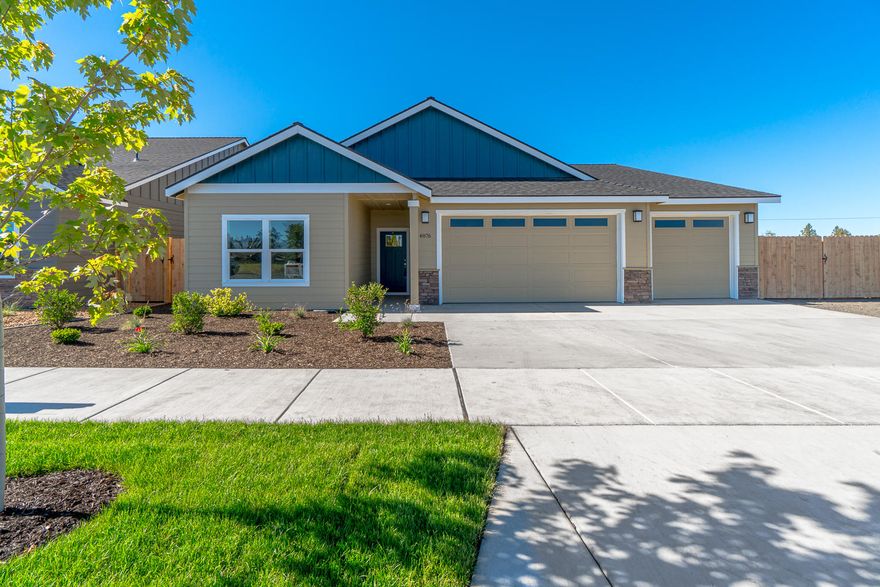 JUST COMPLETED! Affordable luxury built by Dunlap Fine Homes on the Bend side of Redmond w/Cascade Mtn Views. Spacious living both inside & out, w/plenty of room for entertaining. Vaulted Great Room plan w/open Kitchen, tons of cabinetry & prep space on the slab Quartz counters. Neat & tidy full height tiled back splash, SS appliances & farm sink. Living space offers a cozy corner Gas burning fireplace w/stylish accents & room for gathering. Desirable Master separation, walk in closet, step in shower, tiled floors & dual vanities. 2 additional guest rooms off the entry w/full bath. Laundry room w/storage & folding table too! Durable wood look laminate flooring, carpet in the bedrooms & tiled baths. Gas forced air, A/C & back patio. Triple garage, gated RV parking, fully fenced, front landscaped w/auto sprinklers. There's still space in the back yard for a tiny home/ADU, workshop or?  8 unique plans in this community - still time to select finish packages on other homes!