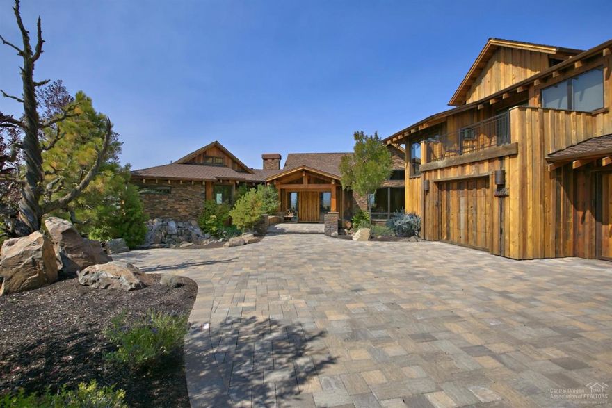 Cascade Mountain Views from beautiful lodge style home-4376 SF 3 bed, 3.5 ba. Rustic Elegance w/ a Blend of Wood, Stone & Natural Surroundings. Country Gourmet Kitchen, Vaulted Ceilings, Hardwood Floors, Stone Fireplaces, Amazing Wine Cellar, Family Room, Deck w/ outdoor kitchen area & Hot Tub. Attached Casita with kitchen, living room, bedroom & bath. Landscaped w/ pavers leading up to 3 car garage. Enjoy all the amenities of Brasada Ranch: golf, swimming, rec room, spa & horse back riding.