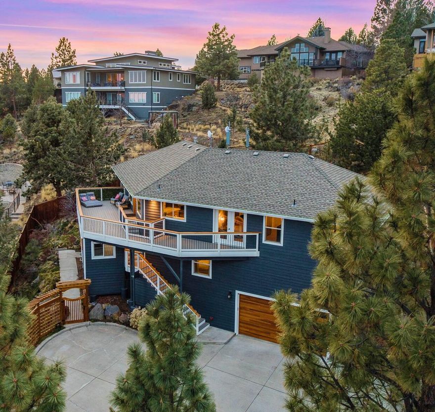 Nestled in the sought-after Aubrey Butte neighborhood, this exceptional property boasts breathtaking panoramic vistas of the Paulinas and Pilot Butte, setting the stage for unforgettable 4th of July celebrations from its expansive deck. Situated on nearly half an acre, this unique lot presents the rare opportunity to add two additional houses or ADUs, offering immense income potential.
The light and bright interior is accentuated by vaulted ceilings, creating an airy and inviting atmosphere throughout the home. The property also features a beautifully remodeled ADU complete with a separate entrance and private yard.
Store all your recreational vehicles with ease on the 80-foot RV driveway.
Experience luxury with a high-end hot tub and newly crafted decking. Additional amenities include a new storage shed, insulated garage door, whole house humidifier, an elegant front door, a garage heater, a charming pergola, professionally landscaped grounds with all new fencing, and much more!