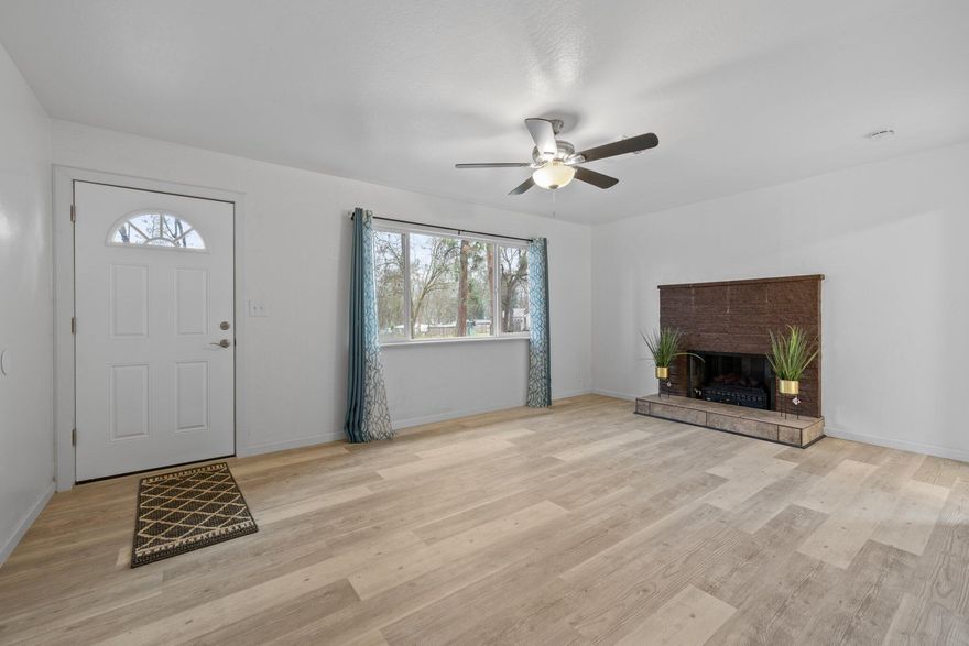 Why settle for a house on a busy street in town when you can be less than 10 minutes from downtown Grants Pass in a country setting? Sweet single level fully remodeled home has been completely updated with all new flooring, new vinyl windows, new roof, overhauled HVAC, new water lines and a new septic system! Brand new dishwasher, range oven, and washer and dryer even included! Low maintenance yard features tons of parking and a nice sized storage shed. Plus, when you're ready to spread out, you're a stone's throw from beautiful Merlin Community Park which features a baseball field, soccer fields, a full basketball court, horseshoe pits, picnic tables and barbeque pits and a full playground for the kids! Enjoy fishing and rafting on the Rogue River with many parks, boat ramps and swimming holes minutes from home. Clean, comfortable and totally turnkey - schedule to see it today!