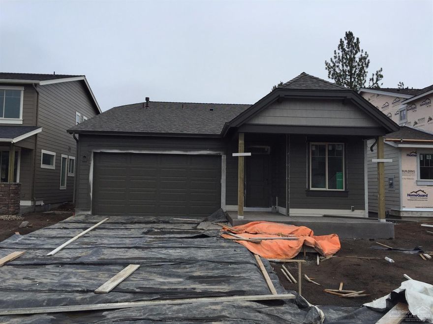 New single level floor plan from Pahlisch Homes features a coffered ceiling in the entry, leading to the vaulted great room with large windows and sliding glass door to the covered patio. You'll love the roomy kitchen with quartz counters, stainless steel appliances. Guest suite features its own private bath. Den/office up front, too. Amazing community amenities, pools, gym, game room, clubhouse, walking trails! Resort-style living in Bend! Photos of similar home, specs will vary. Winston 2B-1651-1.