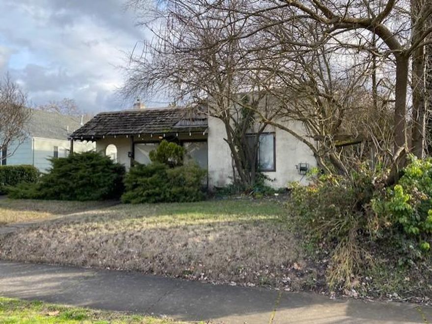 Priced to sell! Prime investment property located in old west Medford. Charming style just needs some love. Two bedrooms, one and a half bath, a nice size yard with alley access. Adequate with a single car garage.