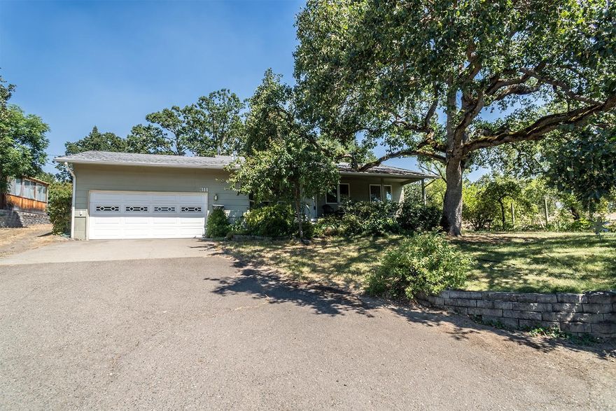 This nearly 1500 sqft 3 bedroom and three and a half bath home is located minutes from downtown but is nestled in a private, unique setting that offers a country feel. Remodeled and added onto in 2004, home features a whopping three full and one half bathroom, vaulted ceiling in the master bedroom, a huge .29 acre lot, and a large detached shop with access and space enough to park an additional vehicle. Situated at the end of a quiet lane; One side of the property runs along the historic, park like IOOF Eastwood Cemetery, providing privacy and a unique location that you wont find elsewhere. Home and property have been lovingly taken care of and are ready for new owners to enjoy!