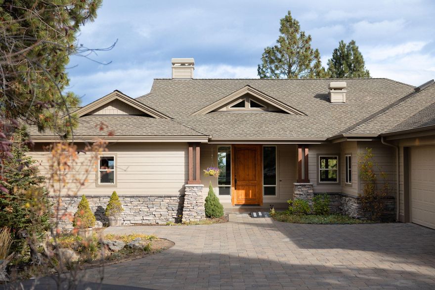 This stunning 3,482 sq. ft. home is located in the highly desirable Awbrey Glen community, offering an idyllic setting surrounded by majestic pines, overlooking the 12th fairway, as well as stunning vistas to the east and northeast. The spacious, thoughtfully designed layout features 3 bedrooms, 3.5 bathrooms, and is perfect for both everyday living and entertaining. The open-concept design includes a gorgeous kitchen, complete with built-in cabinetry throughout the home for added convenience and style. A wet bar with a wine fridge upstairs is ideal for hosting guests, while the full bonus room downstairs offers even more space, including a separate bedroom and full bath for added privacy. For wine enthusiasts, the home boasts a temperature-controlled, 600-bottle wine cellar just off the bonus room, perfect for storing and showcasing your collection. The home is also equipped with newer heating units and dual air conditioning systems, ensuring optimal comfort throughout.