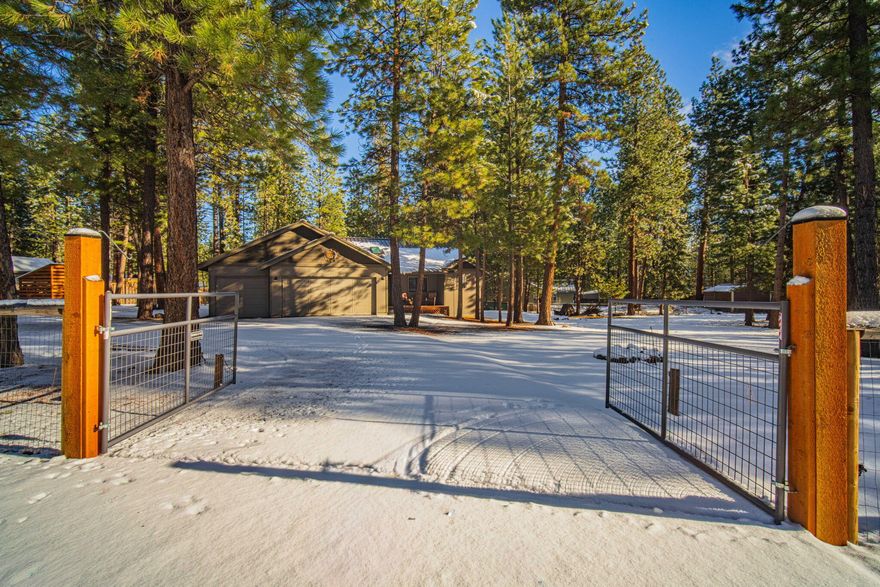 Situated on a fully fenced 0.72-acre lot, this highly upgraded single-level home offers 1,550 sq ft with 3 bedrooms, 2 bathrooms, and a 3-car epoxy-floor garage. The open great-room floor plan features vaulted ceilings, skylights, hickory wood floors, a wood-burning stove, new interior paint, and abundant natural light. The renovated kitchen showcases hickory cabinetry, quartzite countertops, and a waterfall island. New carpet is featured in all bedrooms along with new ceiling fan light fixtures. The primary suite includes a new Jacuzzi walk-in shower, double vanity, and walk-in closet. Enjoy outdoor living on the back deck with fire pit in the spacious backyard. Recent exterior upgrades include a new asphalt driveway, entry sidewalk, fencing, and rock landscaping. Three gated access points allow for RV and toy parking. Wood shed and storage shed included. Community access to private boat launch and park nearby. No HOA. Easy access to Sunriver, Mt. Bachelor, and area lakes.