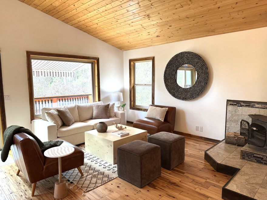 Acreage, Barn & Shop! You can't buy land and build all this for the price! Escape to your own 5-acre retreat in Bend, where peace, privacy, and adventure await. Set beneath towering pines, the home's reverse living design gives you that elevated, treehouse feels like the most magical place to be when the snow starts falling. This fully fenced horse property features a 3-stall/bay barn, fenced pet area, and a cozy wood-heated shop perfect for hobbies or creative work. Multiple decks, a fire pit, and sunset views set the scene for unforgettable evenings. Just off a quiet road, with no eye sore properties nearby and steps from the river and National Forest trails, it's a dream for riders, hikers, and outdoor lovers. Wildlife Corridor location means regular visits from local elk-pure Central Oregon magic. You won't find this kind of land, space, and setup at this price anywhere else!