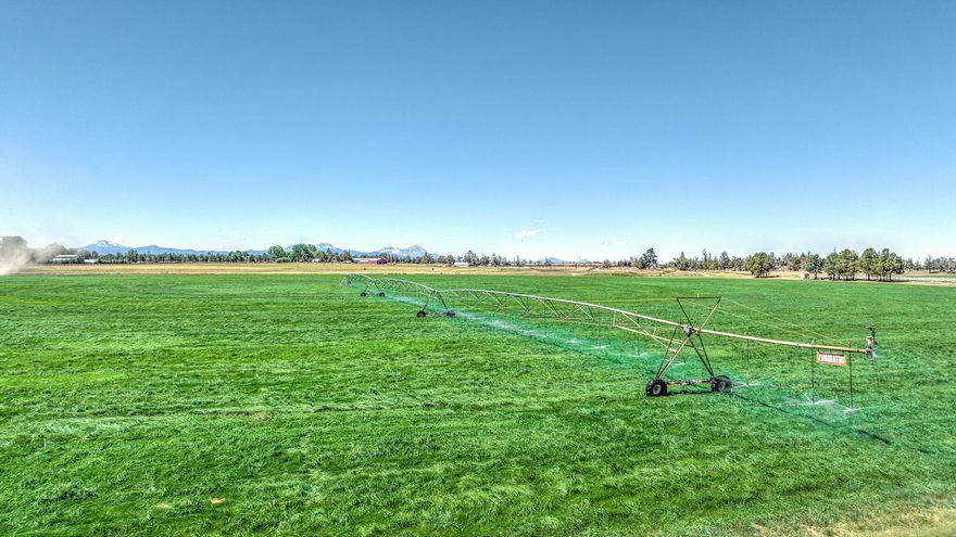 This buildable parcel in East Bend is the perfect blank canvas to build your dreams! Power and well are already in place, septic feasibility is still needed. Additional improvements include a 3 tower Zimmatic pivot and a 12,800 square foot hay shed. This property includes 31.84 acres of COID irrigation and amazing Cascade Mountain views. Located just a few minutes outside of Bend and near everything Central Oregon has to offer, this is the perfect property to raise a family and build a lifetime of memories.