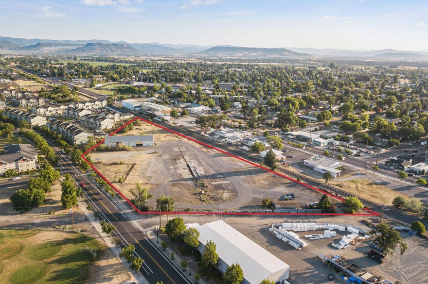 Welcome to 320 North Haskell Street - a highly-desirable development site in Central Point's Twin Creeks neighborhood. The property consists of four parcels across 5.90 acres, with two remaining structures. No re-zoning necessary - the property is already zoned High-Mix Residential (TOD-HMR), Central Point's highest-density zoning. The site is well-positioned close to I-5, Hwy 99, downtown Central Point, numerous parks and schools, and will benefit from low area vacancy and strong tenant demand. Previously the Rogue Valley Bin Company, this site represents one of the last close-in development opportunities of size in Central Point. Twin Creeks, a beautiful master planned development, encompasses ±200 acres, and is situated as a Transit Oriented Development (''TOD'') to promote efficient and sustainable development and increased use of public transit, further enhancing the area's appeal.  Owner-carry financing considered.