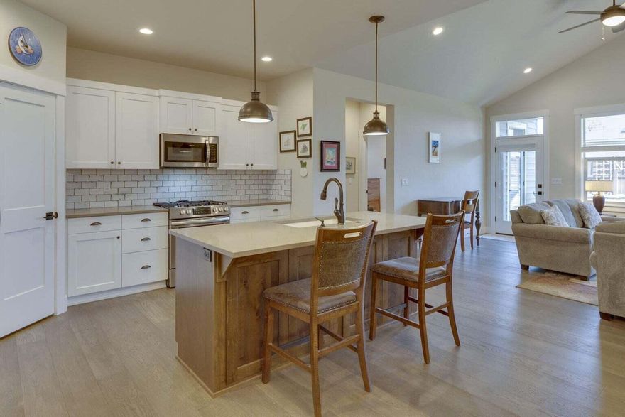 Nestled in the serene SW side of Redmond, Prairie Crossing beckons with its picturesque charm. Step into this stunning 3-bed, 2-bath abode boasting solar panels for an enviable electric bill. Luxurious features abound: wide hallways, tray ceilings, heated floors, and exquisite tile in the primary shower. Entertain effortlessly in the gourmet kitchen with granite counters, gas stove, and walk-in pantry. Hardwood floors gleam under high ceilings, accentuating the spaciousness. RV parking with a 30 amp hook-up and an oversized 2-car garage cater to your convenience. Outside, a landscaped yard, fully fenced for privacy, awaits your enjoyment. Energy-efficient and HOA covering front yard landscaping, and park access this home epitomizes comfort and convenience. Washer, Dryer and natural gas BBQ are negotiable. Seize the opportunity - call your Realtor today and find out how the Oregon Bond Program can help with the interest rate!!