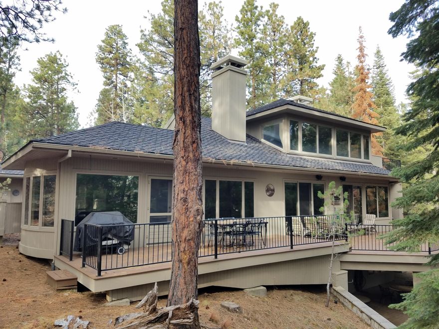 Spring Home #14... A very special setting at the Ranch with a mountain feel and a sense of privacy from its perch on the side of a forested ridge. Centrally located to all amenities at the Ranch. Great room kitchen overlooking family room. Two spacious dining areas for flexibility. Two living areas for optimal enjoyment. Multiple fireplaces. Three spacious bedroom suites for privacy and enjoyment, plus two bunk room suites for fun. Extensive outdoor living is provided by a large main level deck overlooking the forest, a covered lower level patio, private morning courtyard and more. The timeless contemporary design is apparent from the cul-de-sac entrance, paved drive and parking, triple garage and formal covered entrance.