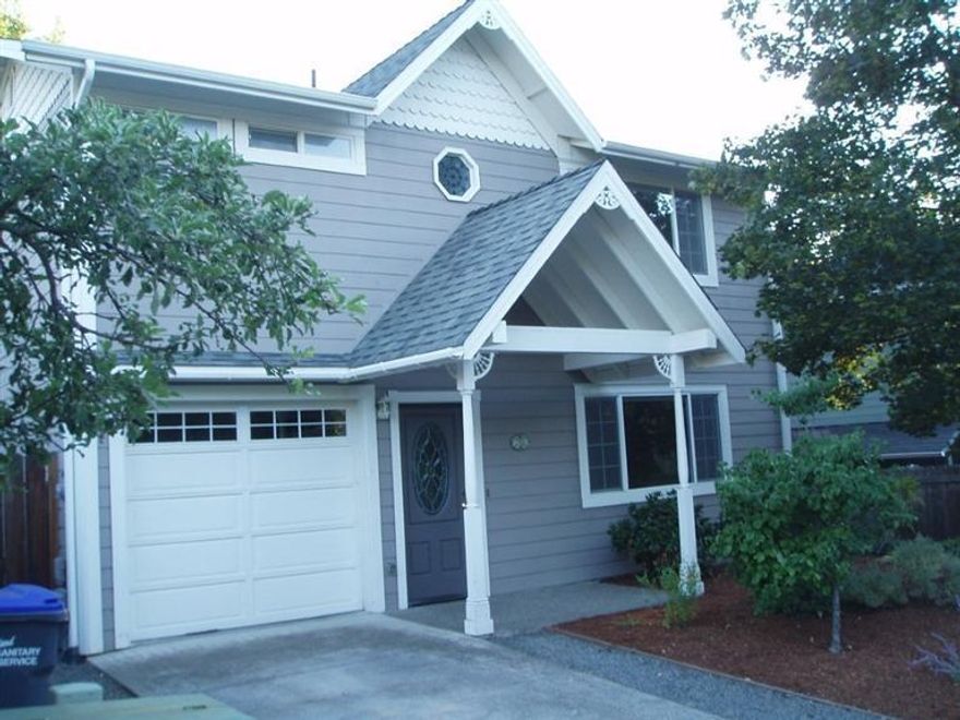 Near downtown but no traffic noise. A flag lot off Oak St. across from Jessica. Cute contemporary cottage in move in condition with new hardwood floor in living room, tile kitchen floor, wisteria covered pergola patio, easy care yard. Large master w/bath, second bedroom with bath. Room on the landing for a computer ctr. New master bath counter to be installed any day. This home would be great for a getaway with no HOA and has been a successful rental property.