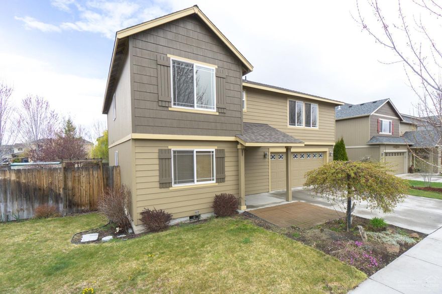 Move in ready home w/ tons of upgrades! Well maintained 3 bedroom 2.5 bath home with a HUGE bonus room & a triple car (tandem) garage - plenty of room for all your Central Or toys! Great room plan w/gas fireplace, designer paint colors, fixtures & hand scraped engineered wood flooring throughout main level. Matching custom hardwood stair treads for a clean, modern look. Outside features a stamped concrete patio, raised beds, mature landscape & enclosed storage. Bring the family and make this your home!