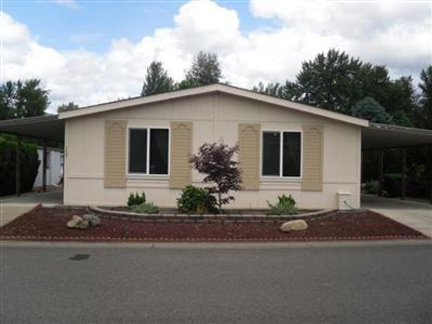 Don't miss this clean, well-kept home in the gated 55+ Mt. View Estates park. Quiet location midpark and occupancy includes use of the pool, clubhouse, jacuzzi, and sauna. Open floorplan with vaulted ceilings and lot's of windows. 2 bedrooms and a den with double doors or 3 bedroom, 2 baths, convenient kitchen with skylight, nice size utility/mudroom, large master bedroom with vaulted ceiling, walk-in closet, skylights. Covered entry/patio, 2 car carport, workshop/storage area and a nice size backyard. Space rent will be $430/month for the new owner.