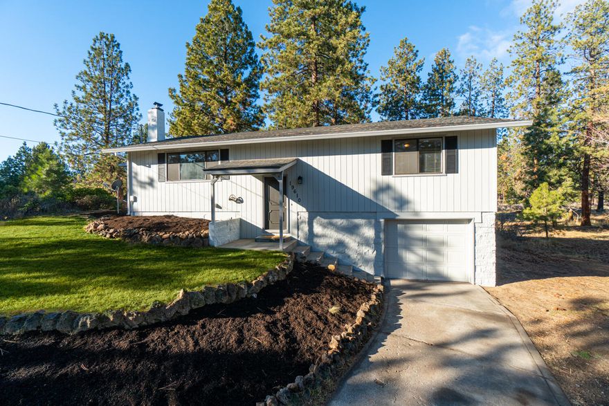 Comfy, cozy stick built home in Deschutes River Woods, ready for you to make it your own! Situated on a .88 acre lot, this 1288 sq ft, 3 bed, 2 bath home offers a certified wood burning insert and a ductless mini-split unit for heat and A/C.
Fresh exterior paint, new dishwasher and water heater in 2020.  This spacious lot allows room for RV parking, a shop, or other needed buildings.  Covered deck area makes for great outdoor living and entertaining. The road is paved, and easy access to Old Mill or Highway 97. Abundant possibilities await!