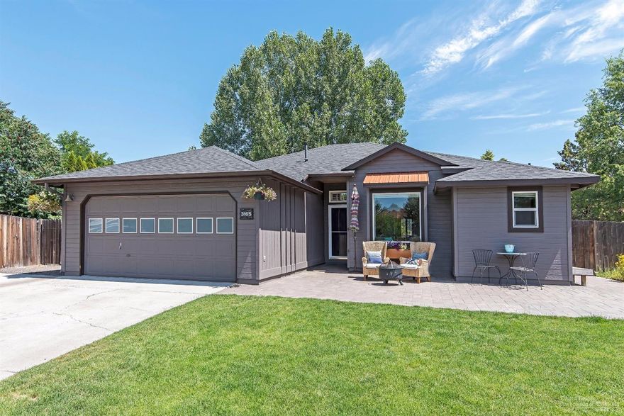 Cute single level home in NE Bend situated in a quiet cul-de-sac close to shopping, restaurants, medical facilities and a neighborhood park & playground. It has been nicely updated with hardwood floors throughout, gas fireplace with stone surround and hearth, quartz/silestone kitchen counters, newer S.S. appliances and recently updated guest bathroom with tiled floors & shower. Large .21 acre lot with gated and covered RV parking, fenced backyard with covered patio, a swim spa and plenty of room to garden.