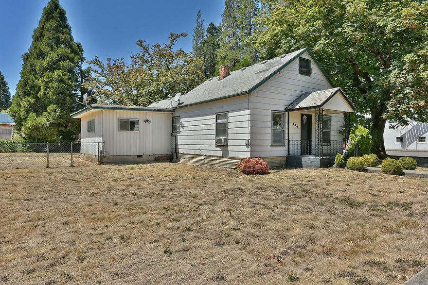 Location, location, location!  Great place to operate your own business in beautiful Canyonville!  Nice, large corner lot with a decent sized patio area.  Detached garage.  Lots of possibilities on this extra sized lot for possible parking/adding on to your business! Back yard has a beautiful matured tree,  Property has been used as residential  (currently vacant), however is zoned commercial property. Buyer to conduct buyer's own due diligence with regards to buyer's intended purposes for property.