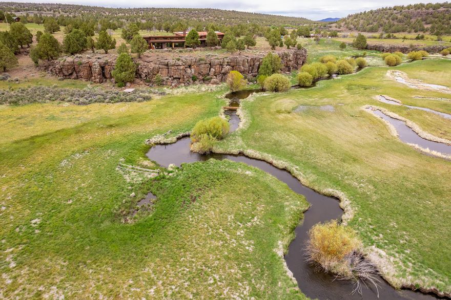 Located 7± miles southwest of Silver Lake, Oregon, just a short, scenic 1-hour 23-minute drive from Bend, Oregon, Pitcher Ranch is comprised of 2,916.9± acres of riparian meadows, rimrock cliffs and outcrops, sagebrush flats, juniper dominated uplands, aspen groves, and Ponderosa pine forests. Flowing down spectacular gorges and meandering through adjacent riparian areas are 2± miles of Buck Creek, and 1.5± miles of Bear Creek. Enjoy watching the wildlife and the beautiful views of the Hagar Mountain and the Buck Creek meadows from your 2,567± square foot custom-built, contemporary-style home with additional 1,200± square feet of shop/garage space. Other improvements include manager's/guest home, guest cabin, tractor barn/workshop, horse barn, hay cover, round pen, and corrals. This beautiful ranch is almost surrounded by BLM or USFS lands, with the ranch headquarters tucked away in a quiet, private valley. The outdoor enthusiast's pursuits will only limited by their imagination.