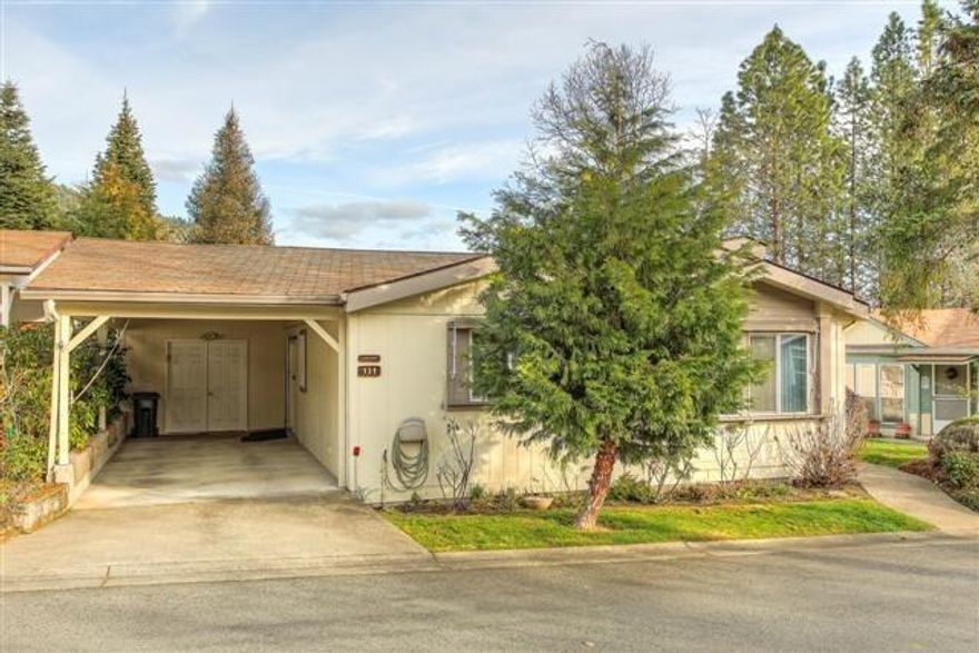 For the young at heart...this 55+ community is nestled away in between mature pines yet close to town. The residents love Highland Heights so much they purchased a flag pole and dedicated it to the Owner and Manager. This adorable home has so much to offer. The beautiful foliage in the front can't wait to wake up this spring. Enjoy the scenery from the large front covered porch which would make an ideal place for morning coffee or to just relax on a peaceful afternoon. The mini stone walk path guides you to the strawberry patches which outline and surround the base of the home. In between those and the rock garden is an existing planter box for the garden enthusiast. Another stone walk path will lead you to the back. The attached shop is 11 x 27. Tell your Realtor you would like to view this property, because once you experience this special community, you will want to call it home.