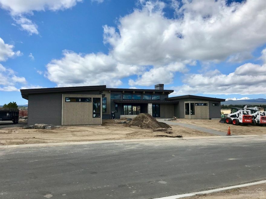 Spectacular single level home under construction by Bend Trend Homes. Gorgeous mountain views. Exterior living spaces enhance the comfort, livability and lifestyle this Tetherow home offers the discerning buyer.
