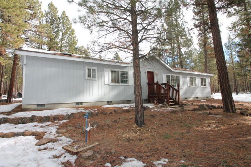Seller is motivated to sell this pride of ownership to new owners.  This three bedroom, two bathroom home is located on 11.9 acres in Klamath Forest Estates.  The home is a newer modular home with open vaulted ceilings, with central heat and air conditioning.  A certified woodstove assists with heating the home.  There's a 1000 sq. foot barn, turned into shops and storage, and is heated.  A riding arena that has been converted to a large garden area, surrounded by fruit trees.  Next to the garden area is a 400 sq ft. insulated storage building.  A portion of the property is fenced and cross fenced.  There's a chicken coop, goat shed, and a fenced duck area. A fire pit and bar-b-que area, and a horseshoe pit.  The water well is 90 feet deep and is great tasting water.