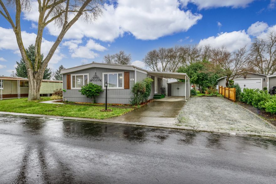 I bet you haven't seen this park! Tucked away at the end of the road with no through traffic, centrally located with convenience to shopping, restaurants and freeways, every space has its own RV parking, with a beautiful tree-line entrance is this 55+ mobile home community, Weldon Mobile Estates. The spacious double wide home is just like brand new with new windows, window blinds, exterior siding, exterior paint, interior drywall, interior paint, heating & air, laminate flooring, recessed lighting, and gravel in RV parking space. The semi-open floorplan has abundant windows, which provides a light & bright living room and dining room. There is a lovely covered front patio for morning coffee or evening barbeques. The landscaping is level & established with a big, beautiful shade tree. There is a storage shed at the end of the paved & covered carport. You will be pleasantly surprised with all this home has to offer! Seller is a licensed real estate broker in the State of Oregon.