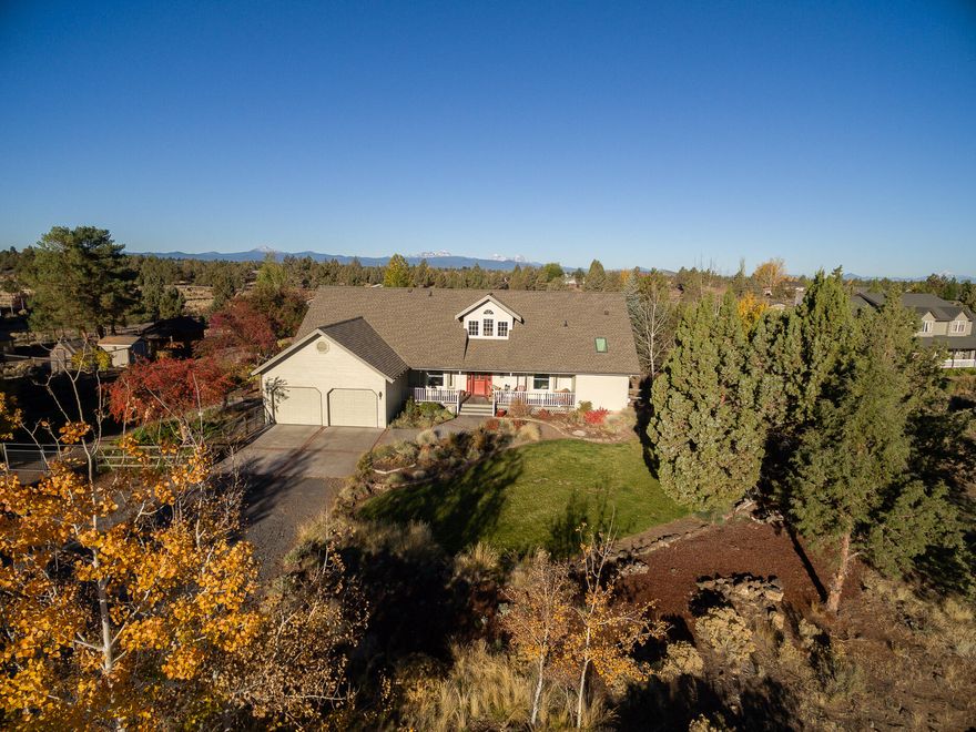 This lovely equestrian estate in SE Bend boasts a remodeled home overlooking garden & horse amenities. Vaulted ceilings in the foyer & family room are balanced by several bay windows & dormers streaming natural light. The thoughtful floor plan features a large primary suite & office on the main floor, with 2 addl beds/ art studio & flex room upstairs. The gorgeous, remodeled kitchen boasts a Viking range & hood, upscale farm sink and charming breakfast nook. Watch the great variety of birds & other wildlife from the expansive deck and covered front porch. Work on pet projects or hobby cars in the 36'x36' heated shop with 12' garage doors. Test your green thumb with 2 greenhouses & raised beds in the deer-proof garden. Horse accommodations include a barn with paddocks, 2 corrals with run-ins, an arena with a round pen, pasture and hay shed. Close proximity to miles of BLM trails to ride horses, walk & bike right from your own property.