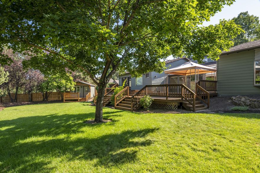 A hidden gem in a great SE location--but you won't see all the goodies in a drive by! You will miss: huge fully-matured landscaped backyd, recirculating pond, fencing 2 sides, 2 storage sheds, plus adorable ''she-shed'', tons of privacy, & very spacious back deck w/canopied pergola! 2 remodels (1993 & 2004) has made this into a comfortable 3 Bed 3 Ba home w/generous Fam Rm w/2nd F/P, + office/den. Cedar ceiling vaults over the main living area, bay window in the Great Rm w/F/P, oak hdw floors thruout Kit/Dining/Hall. Granite cntrs in Kitchen & appliances (included) were updated during remodel. Primary suite features walk-in closet w/attic access for storage,  Bath has jacuzzi tub, tile shower & dbl sinks. Garage features generous built-in storage units. New roof, new septic, & exterior paint in last 3 yrs. Shades on clerestory windows are on a remote. Note: property to south has recently been purchased & is being renovated.