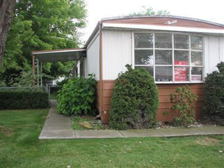 Country Private Park at the end of Stearns Way. The Only Park that has RV parking next to mobile. Large yard with mature landscaping. Great park for Snow Birds. This 2 BR has big front windows, kitchen eating area, spacious kitchen, lots of storage, built in bed with storage under and extra storage shed off carport. Easy to show vacant with key box. Good Buy! Property sold AS-IS.