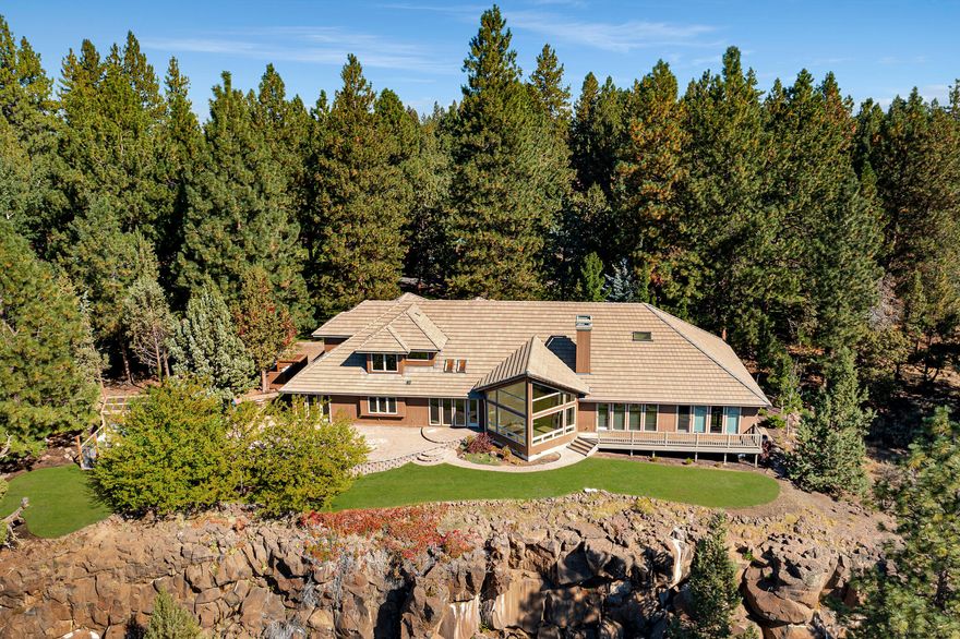 Price just reduced another $400,000! Extraordinary property w/3.9 acres & 470ft of mesmerizing Deschutes River frontage w/future development potential! The beautifully remodeled 4,680sq ft custom home features a grand entrance w/showpiece chandelier, & elegant spiral staircase. Huge arched walkways lead to a stunning vaulted living room w/full height granite slab mantle/propane fireplace, & huge bay windows overlooking panoramic river/mtn views. Gourmet kitchen w/top of the line appliances, enormous island w/new marble counters, & designer backsplash. Main level vaulted mstr w/huge walk-in closet, private flex rm, & mstr bath w/marble walk-in shower/soaking tub/bidet. New flooring, paint, surround sound, whole house intercom & remote window coverings. Rooms include; theater rm, gym, Lrg bonus rm, office, 2 lrg bedrooms w/walk-in closets & beautifully remodeled guest bath. The grounds are manicured in a park like setting w/huge trees, labyrinth path, paver driveway/patio, & greenhouse!