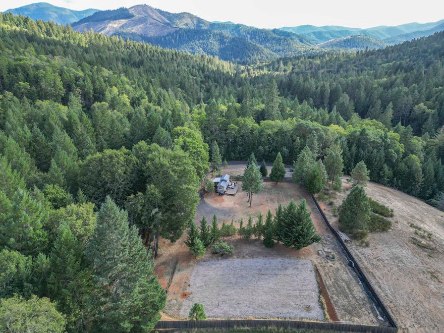 Prime Build-Ready Lot Near Grants Pass Welcome home builders! This improved property offers an excellent opportunity to build your dream home in a beautiful, private setting just outside Grants Pass. With a gated entrance and a well-built rock driveway leading to the designated building site, this property is designed for convenience and security. Key features include: •New fencing around the flat area •Septic system already in place •High-yield well (12 GPM) •Prior home site approval for an easy building process •Power at the property line for quick hookup •WR zoning (Woodlot Resource) with potential timber value Enjoy the perfect blend of privacy and accessibility with this ready-to-build property. Don't miss out on this fantastic opportunity!