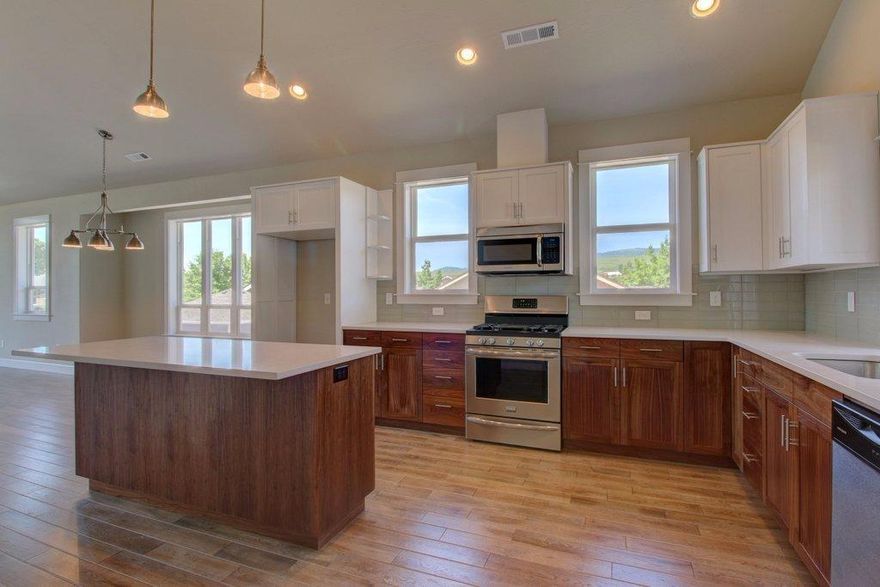 Completion date, April 2016! This 3 bedroom, 3 bath 2086 sqft custom home features a fabulous bonus room, vaulted ceilings, granite counter tops, stainless appliances, tiled baths, walk-in-closet in the master suite and gas fireplace in the great room. Extra large windows will let in the light and fabulous Siskiyou mountain views. The main level,which also includes the master bedroom, can be accessed directly from Stoneridge ave and the alley provides access from the rear to the lower level two car garage. This home is built by Dave DeCarlow of Silverstone Construction, known for his attention to detail and impeccable craftsmanship. One short block from the Kestrel Park open space and Bear Creek access, this location provides easy access to North Mountain Park and trails and yet is close to town. Not part of Mountain Meadows, HOA is @$40/mo. Agent related to owner.