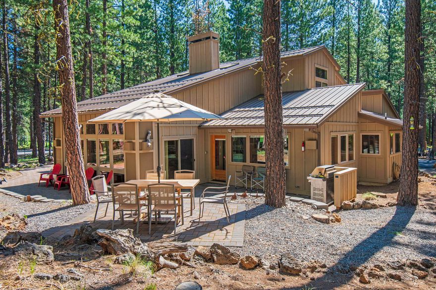 Location doesn't get any better than this. Tucked in the mature ponderosa pines and bordered with common area space all around, this home provides privacy, views of the 6th and 7th holes of the championship, Glaze Meadow golf course, and easy access to the Glaze Meadow recreation center. Completely remodel in 2005, this home boasts a fresh feel throughout, including vertical grain fir cabinetry and matched with beautiful granite countertops. The marriage of warm wood and iron accents sets this home apart. A beautiful gas fireplace with stone mantel accents the great room's vaulted ceilings with a view of the loft above. The primary bedroom is located on the main floor and its bathroom features a dual vanity, ornate pull handles on its cabinets and raised countertops for your comfort. 4 spacious bedrooms has access to their own private bathroom. Outside, you are greeted with a beautiful paver patio wrapping all along the backside of the home.Enjoy dinners from the raise eating area.