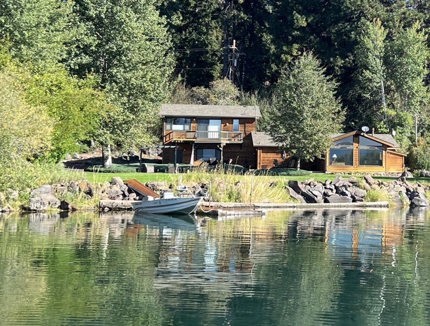 One of a limited collection of homes on Pelican Bay in Rocky Point and is located adjacent to one of the very best fishing holes on the lake.  Lunker wild trout are waiting for you. This rare waterfront home has a private dock in a multi-acre, park-like setting.  Every window facing the bay has a picture-postcard view of the Upper Klamath Lake Wildlife Refuge. There is over 140 ft of shoreline.  The home has 3 bedrooms and 2 baths.  The open style kitchen has quartz counter tops and opens to the great room.  The great room offers an expansive view of the grounds and the bay. There is plenty of natural light throughout the home.  There are both an office and a hobby room.  An attached two car garage includes a workbench. There is both a RV storage shed and  utility shed.  The compound is off the main road in a private, secluded setting. Don't let this beautiful waterfront home slip away! (More photography on it way!)