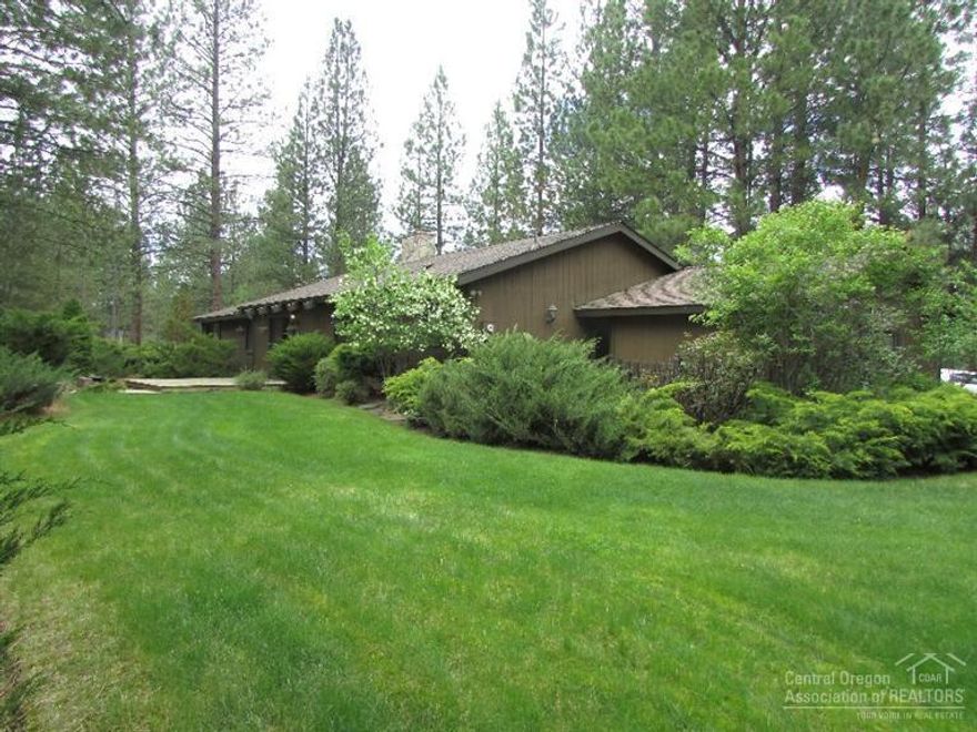 This single level ranch style home is located in a peaceful wooded 2+ acre lot in the desirable neighborhood of Woodside Ranch. This home has 14' Ceilings in living, dining, family and kitchen. The baths have travertine and marble tile. You can make this an amazing home with a little TLC. You have your double attached garage and on top of that you have an additional 2 car/shop garage with RV. The home has been beautifully landscaped. Enjoy the peace and quiet surrounded by tall Ponderosa Pines.