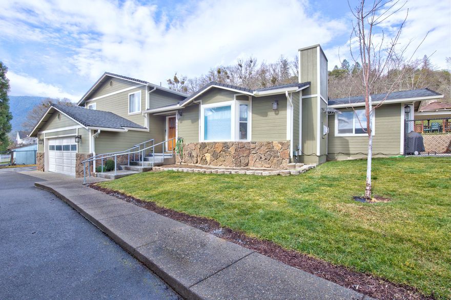 Craftsman Style Home in Rogue River!  This fully remodeled split level sitting on .43 of an acre, was built in 1989.  The home features 4 bd, 4 ba, approx. 2780 sqft., a galley kitchen with Quartz counters, under cabinet lighting, and offers immense storage with a built-in pantry and a pantry closet. Espresso bamboo hardwood flooring throughout & carpet in the upstairs bedrooms. Enjoy the master bedroom with two large closets. Master bath has a large soaking tub, tile surround shower, and a double sink vanity. Finished daylight basement w/bathroom.  The attached 2 car garage provides plenty of storage with approx.. 572 sqft of space. With the approx.. 854 sqft carport and almost a quarter acre of paved parking there is plenty of room for all your toys! Bring your hobbies and crafts to utilize the approx. 144 sqft shed and the approx. 160 sqft outbuilding. Spend the evenings under your gazebo with a view of the mountains.  Close to schools and shopping!