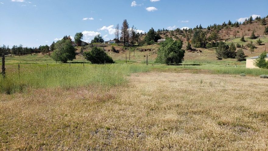 This commercial property has great visibility which is located on the East end of Prineville. One of a kind 4.83 acre parcel zoned C2 with 356 feet of US Hwy 26 frontage. Largest C2 parcel available in Prineville. City services available and also has frontage from Laughlin Road on the north side, making access to the property open and convenient. Potential for a variety of uses. Property is in the path of Prineville's economic growth. Seller would prefer to carry contract with 30%-35% down.